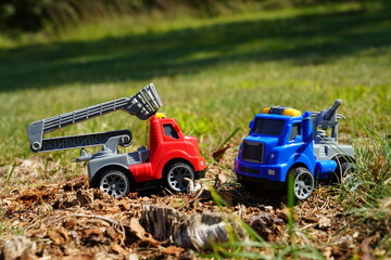 Young child's toy truck set sitting outside.