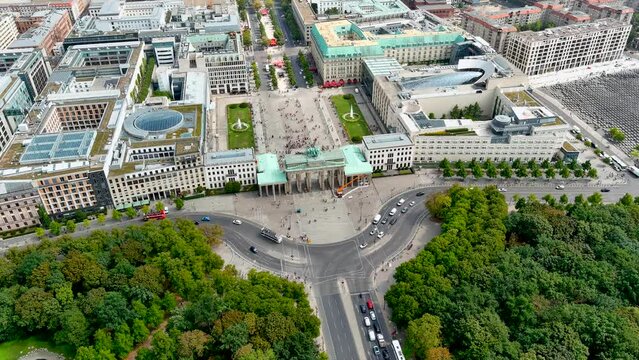 Aerial View of Brandenburg Gate (Brandenburger Tor) in Berlin, capital of Germany, Europe. From above of famous European city landmarks around neoclassical monument ft. touristic town center 4K