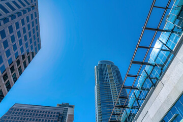 Fototapeta na wymiar Austin Texas skyline against sunny blue sky with glass buildings and apartments