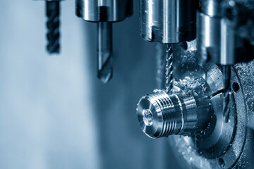 The multi-tasking CNC lathe machine swiss type tapping the brass shaft parts.