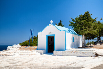 Obraz na płótnie Canvas Typical white and blue greek chapel in Rhodes island, Greece