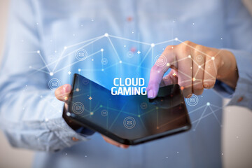 Businessman holding a foldable smartphone, new technology concept