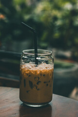  An iced latte drink at a garden theme cafe for cooling down during summer heat