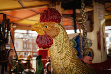 cockerel carousel ride form of a chicken 