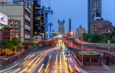 Fototapeta na wymiar Blue hour twilight shot of New York City traffic and the Queensborough bridge