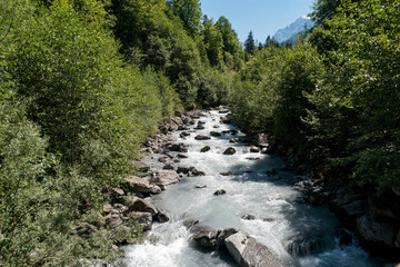 Mountain river Gornerer in the valley. River valley in mountains. Mountain river landscape. River in mountain forest