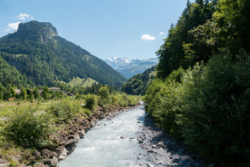 Fototapeta na wymiar Mountain river Gornerer in the valley. River valley in mountains. Mountain river landscape. River in mountain forest
