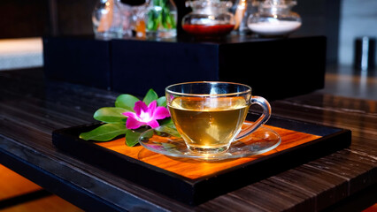 Cup of healing ginger tea after massage at resort and spa salon