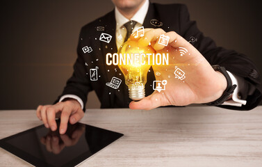 Businessman holding a light bulb, social media concept