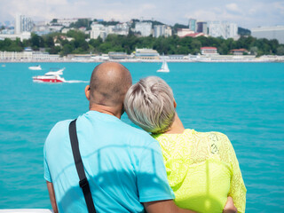 Fototapeta na wymiar The couple looks at the beautiful sea view. Seascape