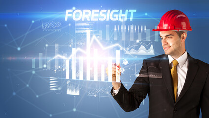 Young businessman with helmet drawing on virutal screen