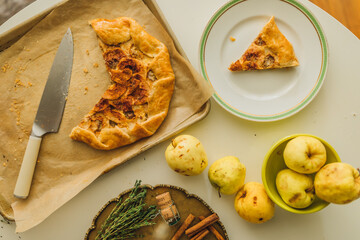 apple almond frangipane galette from above on baking tray with knife