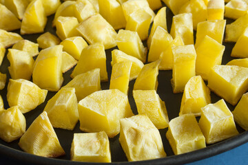 Close-up of a plate of oil-free French fries cooked in a microwave black plate.