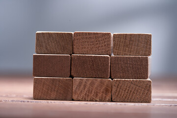 Stack of wooden blocks on gray background