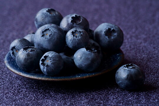 Background with berries - fresh bilberry; Vaccinium Myrtillus