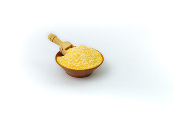 Wooden bowl full of corn flour with a wood scoop