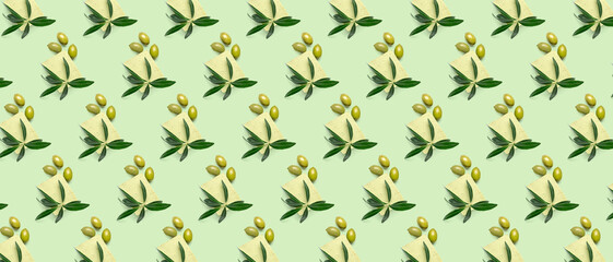 Many soap bars with olive oil extract on green background. Pattern for design