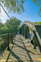 Fototapeta na wymiar River Walk in San Antonio Texas with a bridge overlooking blue sky and water