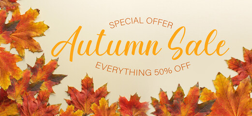 Banner for autumn sale with maple leaves on light background