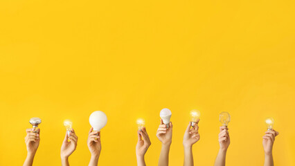 Many hands with different light bulbs on yellow background