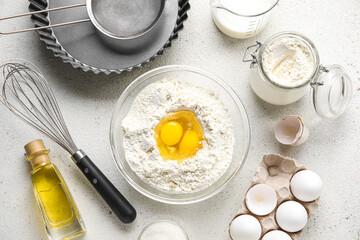 Different ingredients for baking on light background