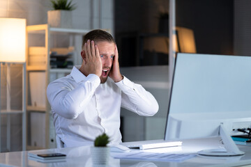 Frustrated Businessman Looking At His Computer Screen