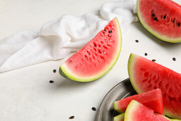 Plate with slices of watermelon on white background