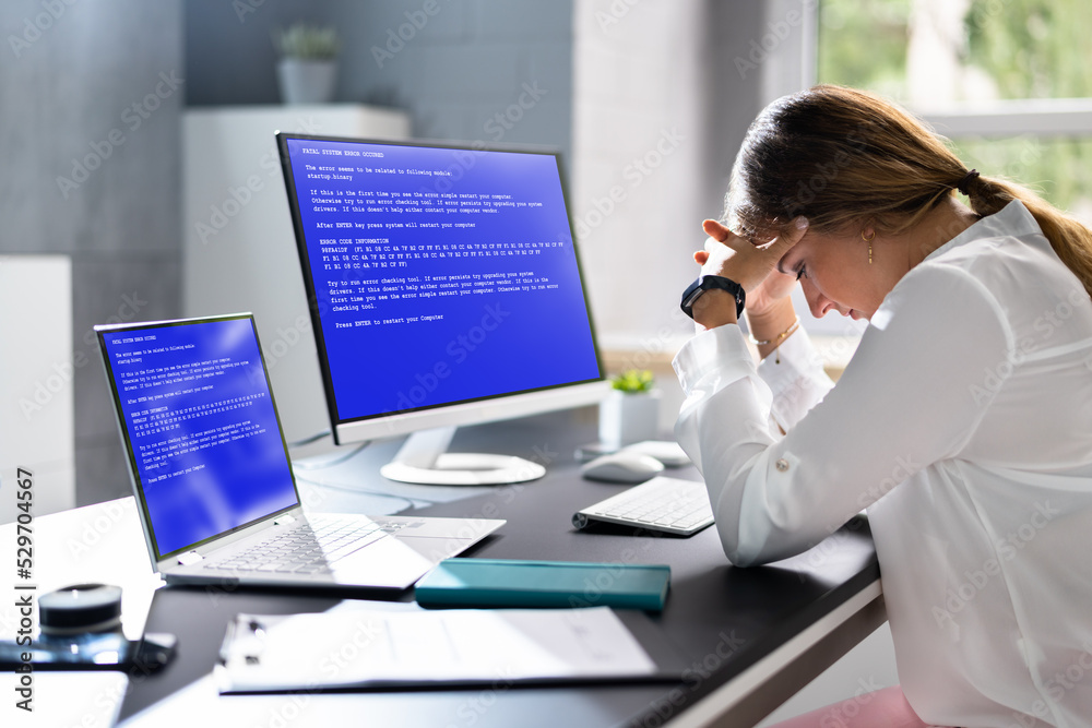 Poster worried woman at computer with system failure screen