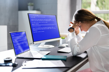 Worried Woman At Computer With System Failure Screen