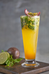 fresh passion fruit mojito soda served in glass side view of healthy drink