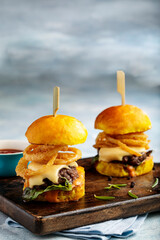 roaring beef slider burger served in a dish side view isolared on wooden table