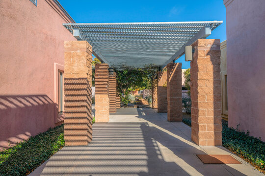 Tucson, Arizona- Concrete wide walkway with metal mesh roof