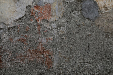 Cracked and rough stone wall texture, different materials like stone, concrete and cement surface, no person