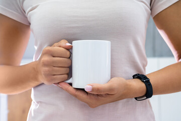 Fototapeta na wymiar Woman Holding Coffee Mug