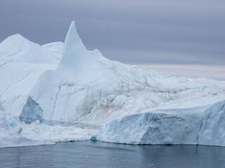 Awe-inspiring icy landscapes at the mouth of the Icefjord glacier (Sermeq Kujalleq), one of the fastest and most active glaciers in the world. A UNESCO world heritage site, Ilulissat, Greenland

