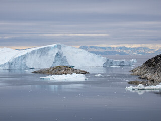 Awe-inspiring icy landscapes at the mouth of the Icefjord glacier (Sermeq Kujalleq), one of the fastest and most active glaciers in the world. A UNESCO world heritage site, Ilulissat, Greenland
