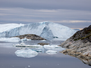 Awe-inspiring icy landscapes at the mouth of the Icefjord glacier (Sermeq Kujalleq), one of the fastest and most active glaciers in the world. A UNESCO world heritage site, Ilulissat, Greenland
