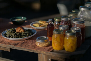 Homemade food and canned goods on a rustic table