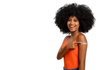 Black teen girl smile and points to her arm with vaccine sticker, she does not wear face shield - obrazy, fototapety, plakaty