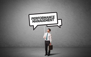 business person in casual holding road sign