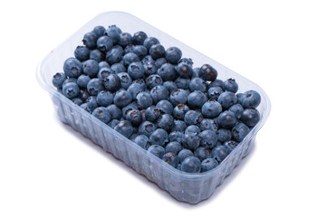 Blueberries in a plastic container isolated on white background.