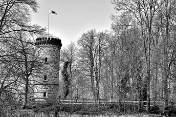 flamed flag on the old castle tower, tecklenburg, germnay