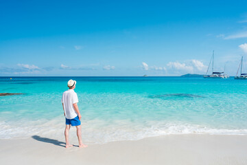 Tourist standing at the beach on a tropical island