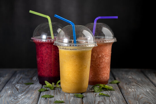 Fresh Fruit Smoothies On A Dark Background. Non Alcoholic Beverages