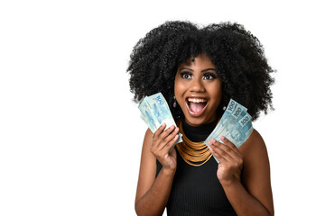 young black woman smiling holding brazilian money bills, positively surprised, space for text, person, advertising concept	
