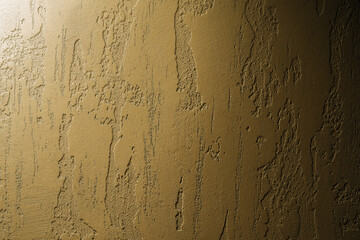 Fototapeta premium Venetian golden plaster background. Mock up of textured wall