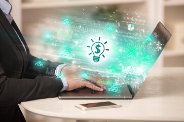 Young man watching stock market on laptop