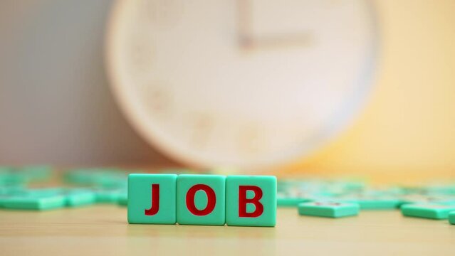 The word JOB made of small colorful cubes with letters. . High quality 4k footage