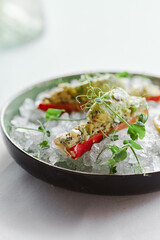 crab cooked in a restaurant and served on ice