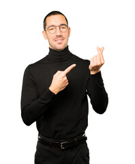 Young man making a gesture of worried about his economy